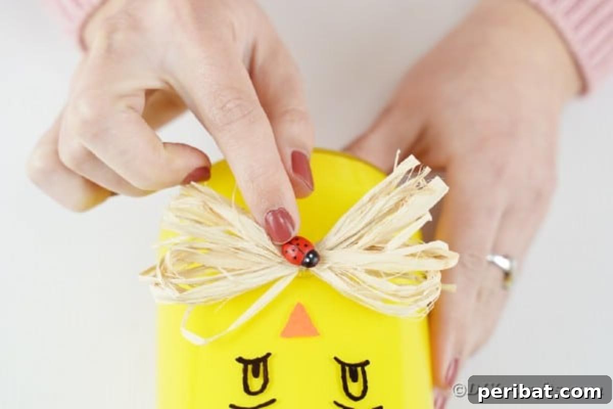 Repurposed Mason Jar Hen House Vase 12 Adding a small ladybug embellishment to the raffia bow