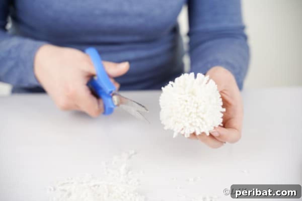 Hoppy Easter Bunny Wall Art DIY 12 Trimming yarn pom pom to create a neat fluffy tail