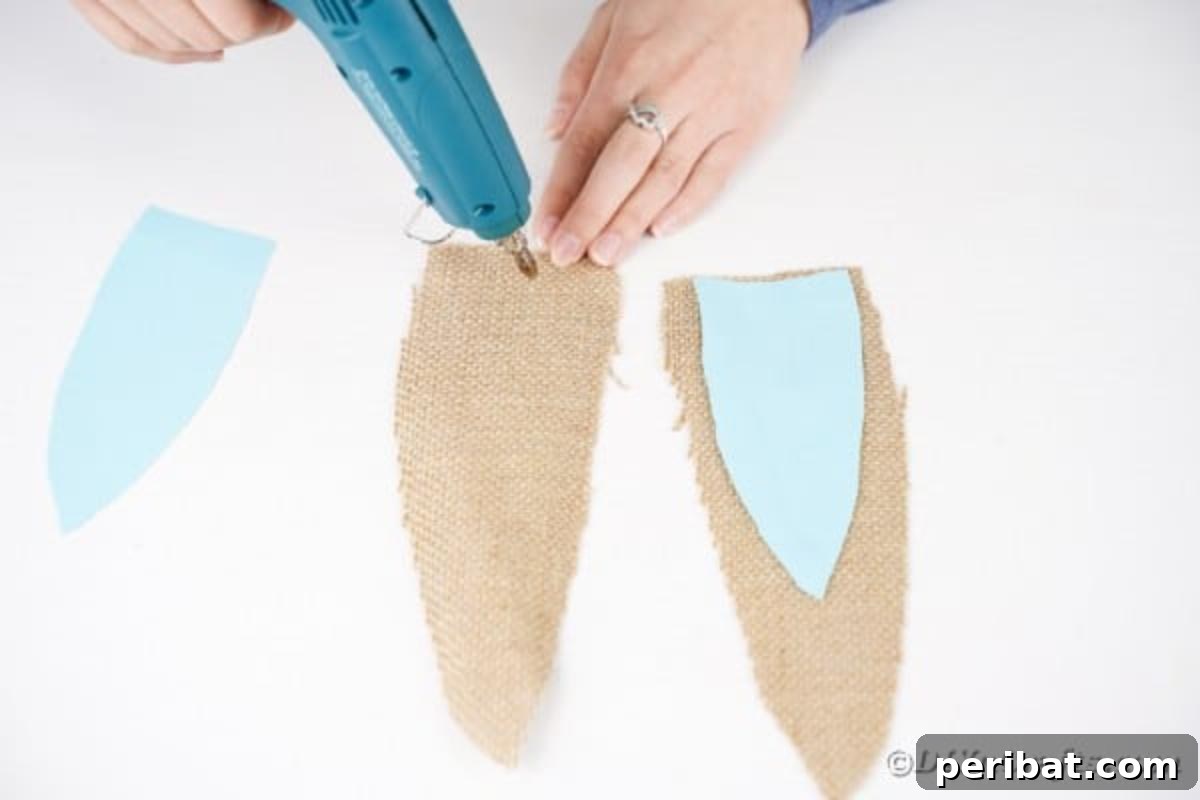 Hoppy Easter Bunny Wall Art DIY 15 Gluing smaller patterned fabric onto burlap ear shapes