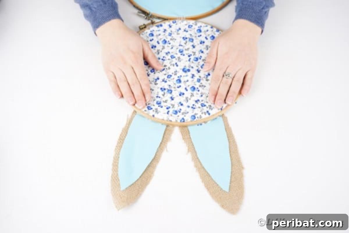 Hoppy Easter Bunny Wall Art DIY 16 Attaching the prepared ears to the back of the top embroidery hoop