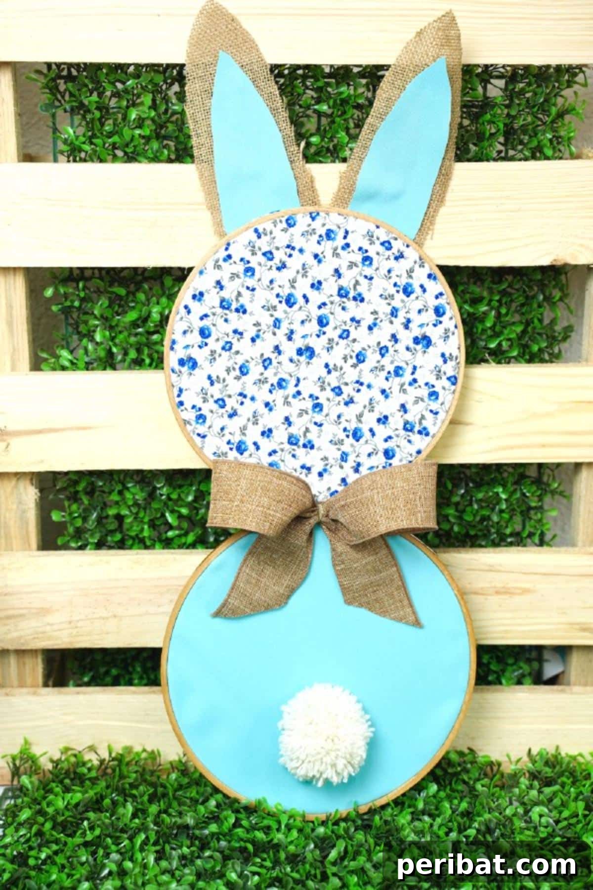 Hoppy Easter Bunny Wall Art DIY 19 Finished fabric bunny wall art displayed in front of a rustic wooden pallet