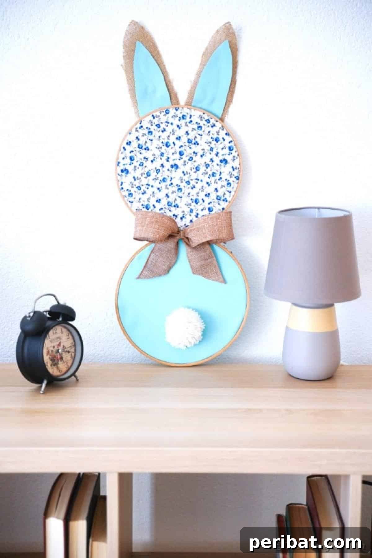 Hoppy Easter Bunny Wall Art DIY 4 Fabric bunny wall art with floral and burlap accents displayed on a table next to a lamp