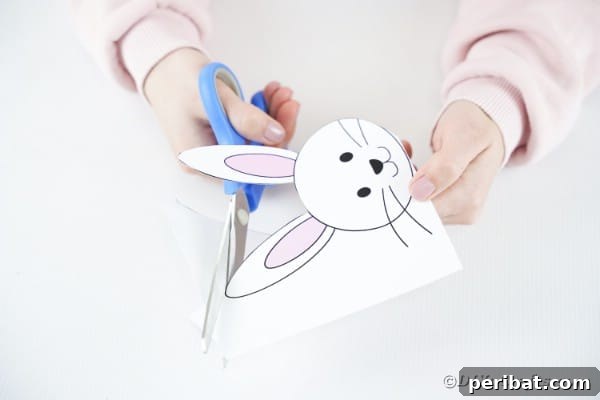 DIY Easter Paper Bunny Craft Free Printable Template 19 Cutting out the bunny head from the template