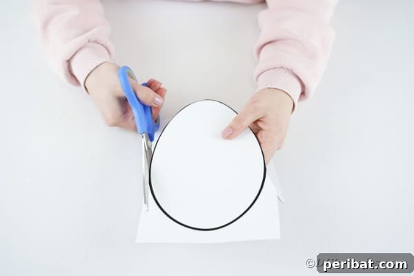 DIY Easter Paper Bunny Craft Free Printable Template 20 Cutting out the bunny's egg-shaped body