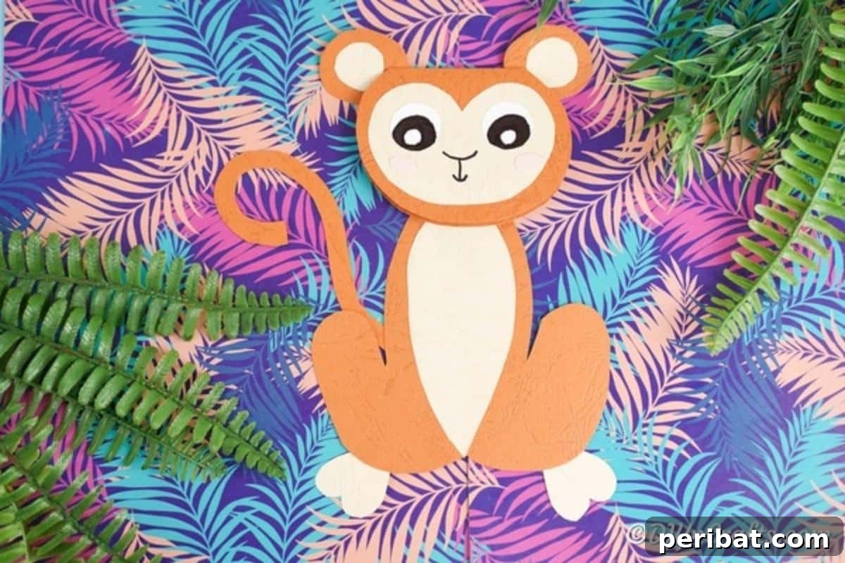 DIY Monkey Card Fun for Kids 3 A cheerful paper monkey card resting on a vibrant, patterned paper background reminiscent of a lush rainforest, highlighting its playful design.