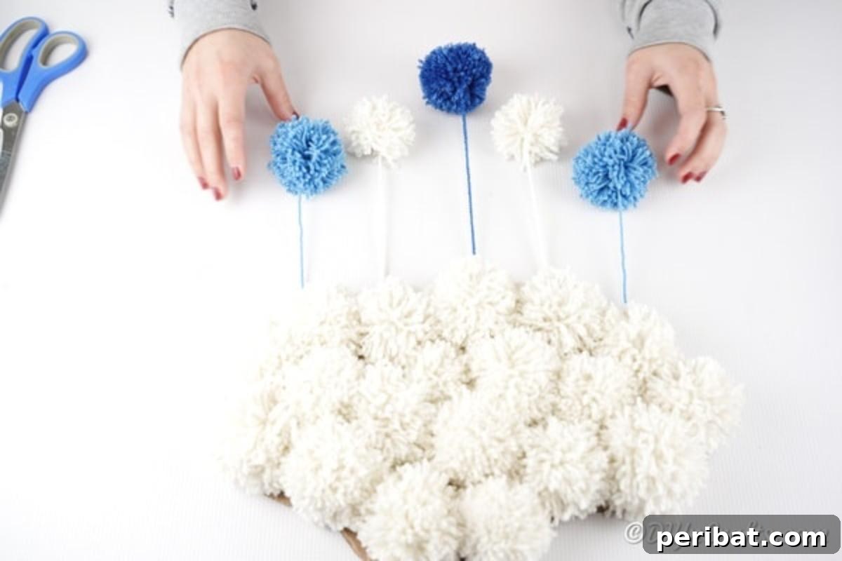 Finished yarn pom pom cloud art ready for display