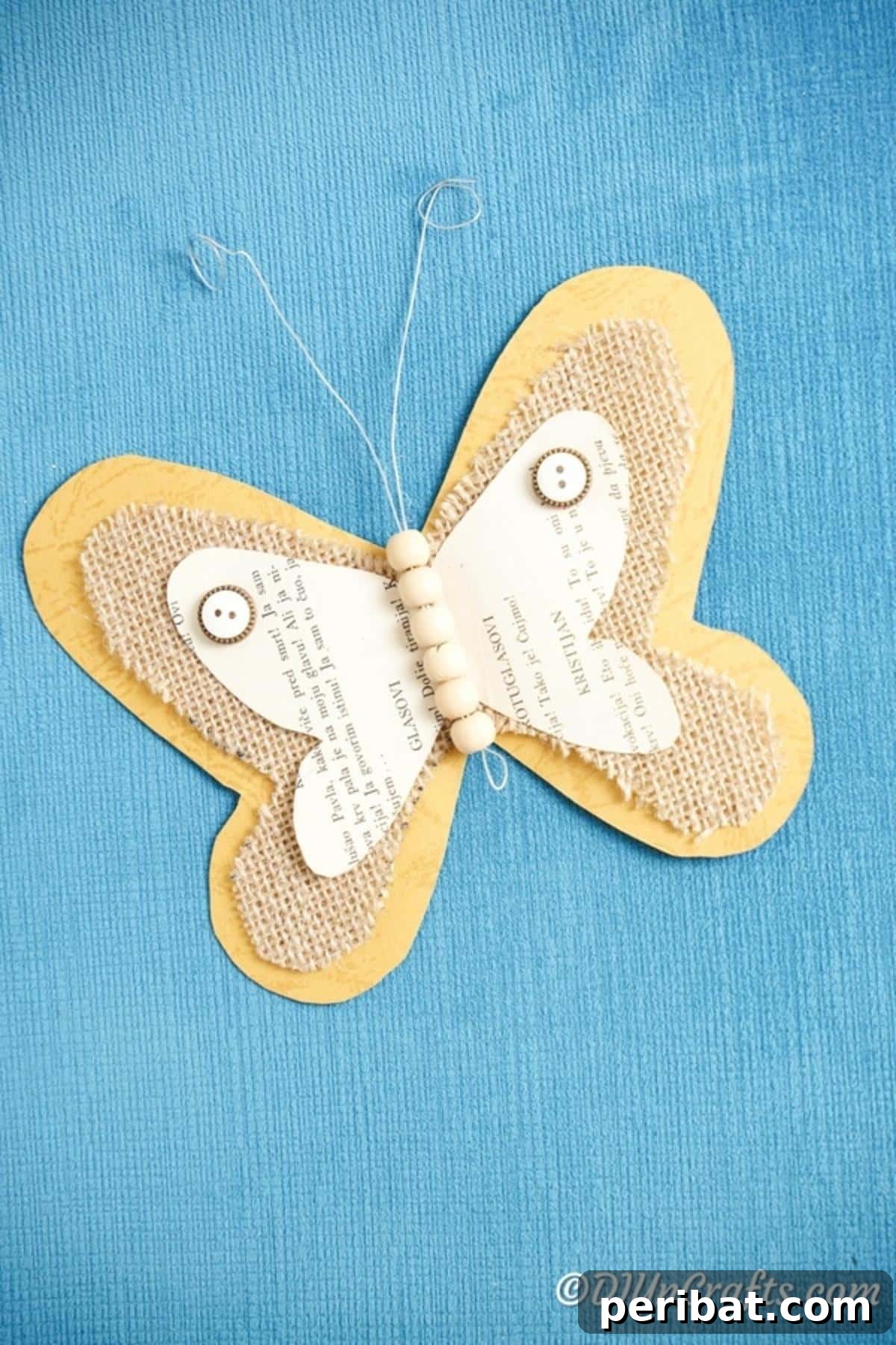 Whimsical Rustic Burlap Butterfly 4 Butterfly on blue surface