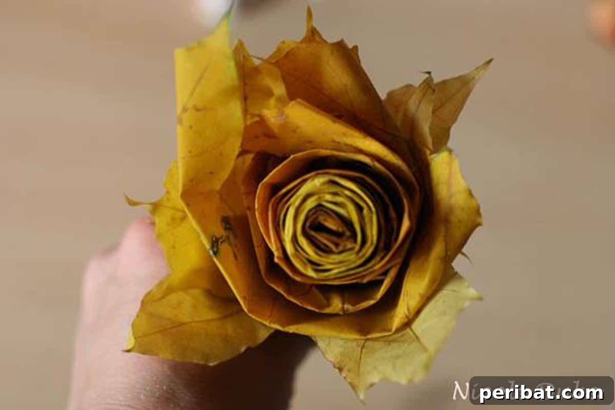 Two handmade maple leaf roses displayed together, highlighting their natural beauty and craftsmanship.