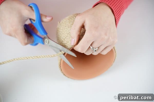 Hoppy Hot Air Balloon Easter Craft 18 Cutting excess twine off terra cotta pot