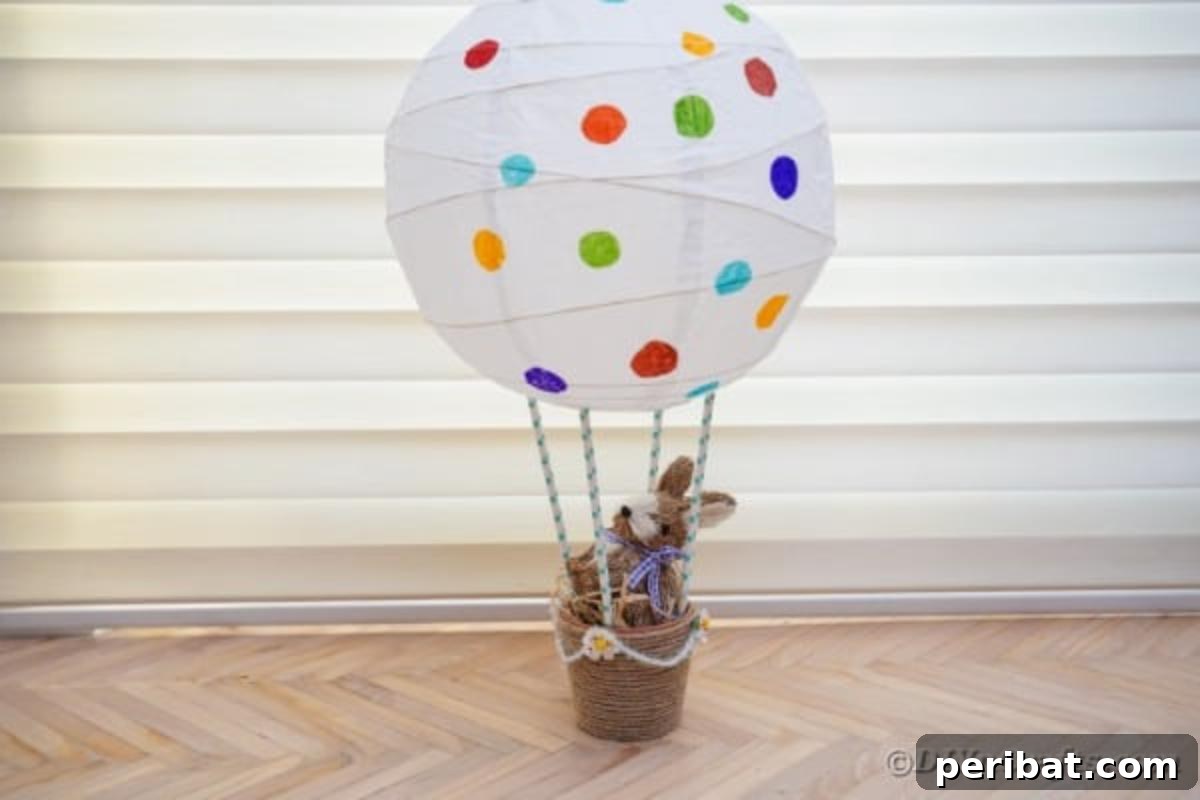 Hoppy Hot Air Balloon Easter Craft 5 Easter bunny air balloon craft positioned in front of a window, bathed in natural light