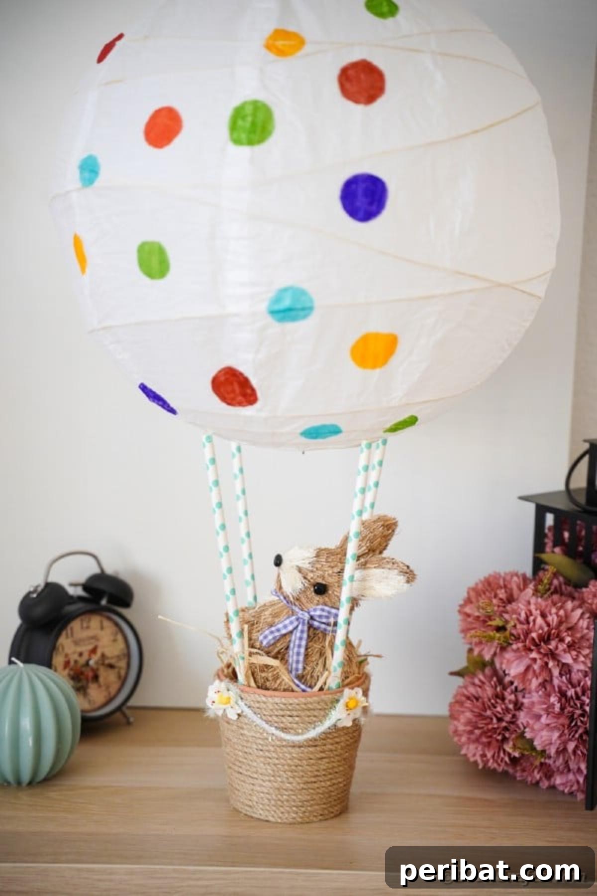 Hoppy Hot Air Balloon Easter Craft 6 Easter hot air balloon craft placed next to a vase of flowers, showcasing its ability to complement natural elements