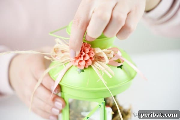 Adding flower to raffia bow
