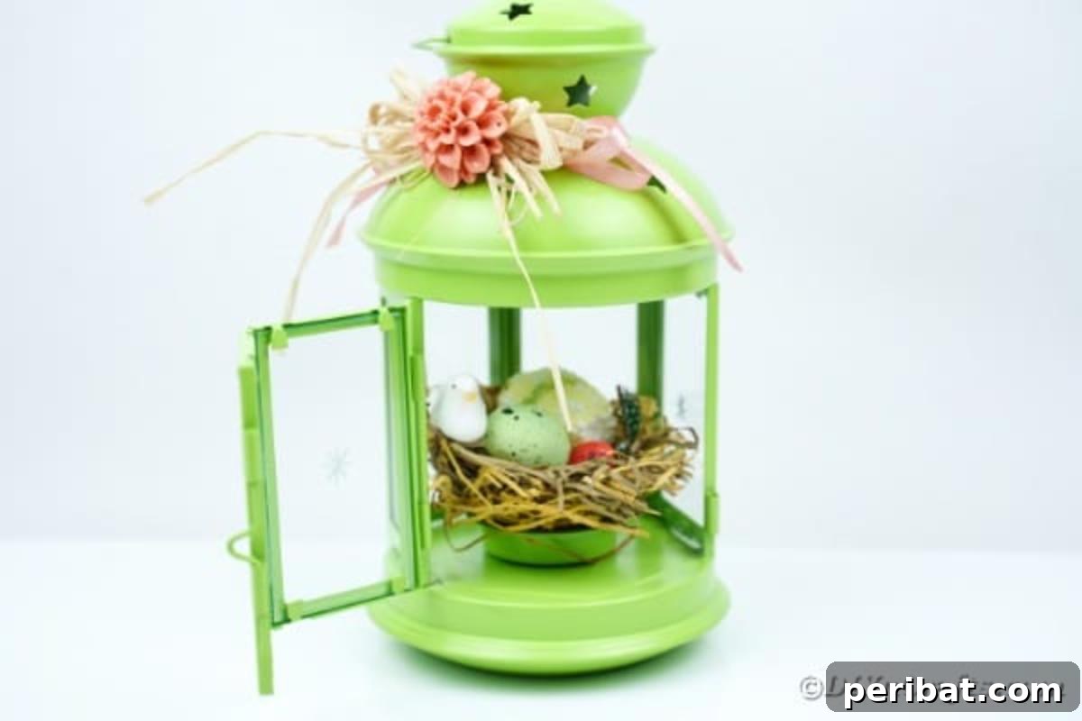 Green lantern with spring accents on white table, ready for display
