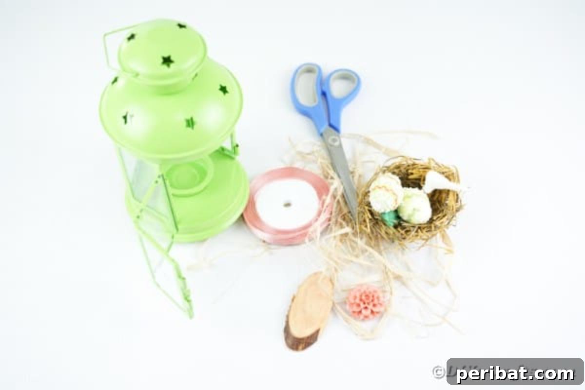 Supplies for green Easter lantern craft laid out on a table