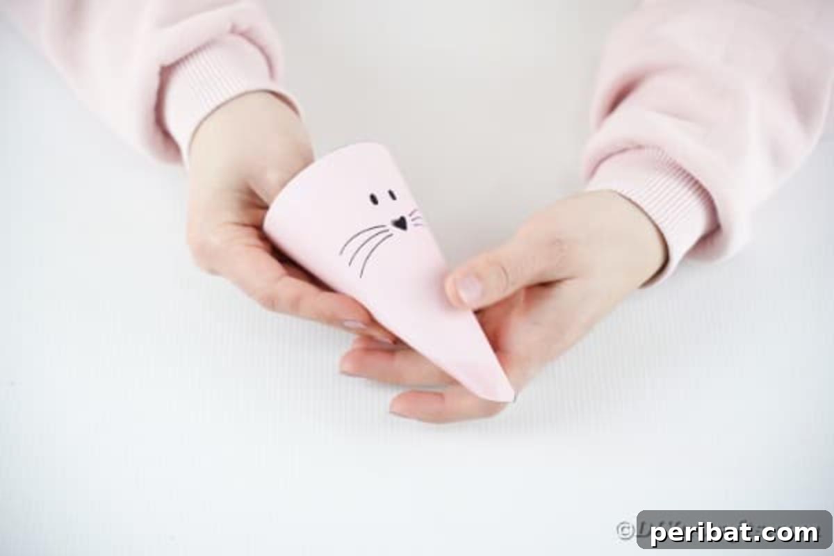 Free Easter Bunny Treat Holder Template 11 Rolling the paper treat bag into a cone shape and securing with tape