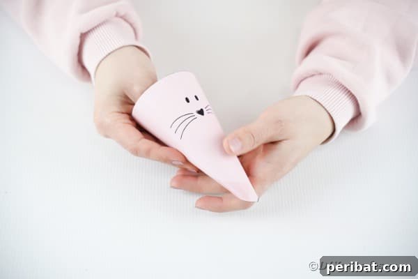 Free Easter Bunny Treat Holder Template 19 Rolling treat bag into cone shape
