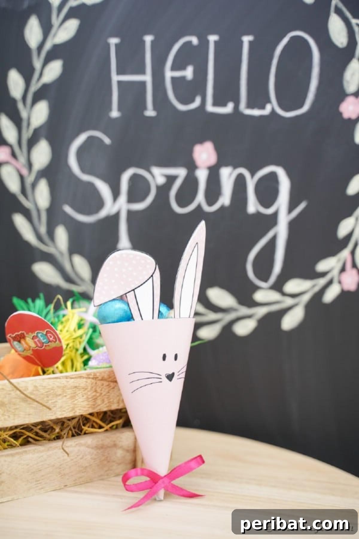 Free Easter Bunny Treat Holder Template 4 Easter bunny candy holder placed on a table near a chalkboard