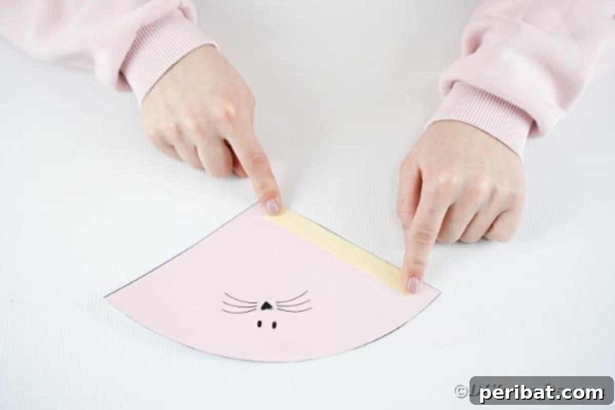 Free Easter Bunny Treat Holder Template 10 Applying double-sided tape to one edge of the flat bunny cone template