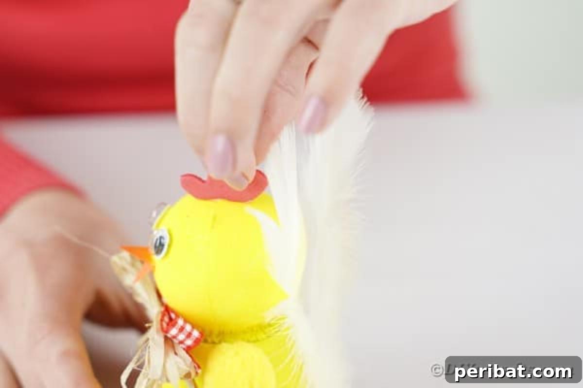 Whimsical Upcycled Hen Planter for Easter Decor 13 Gluing a red comb onto the chicken's head