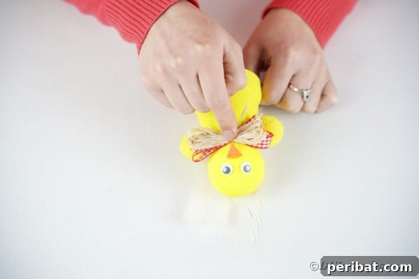 Adding bow to neck on chicken