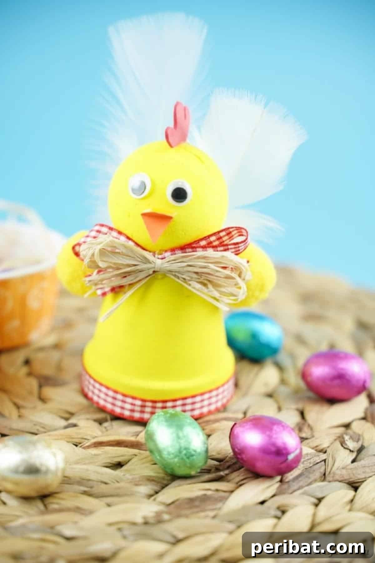 Whimsical Upcycled Hen Planter for Easter Decor 4 Yellow chicken planter on woven mat, ready for Easter decorating
