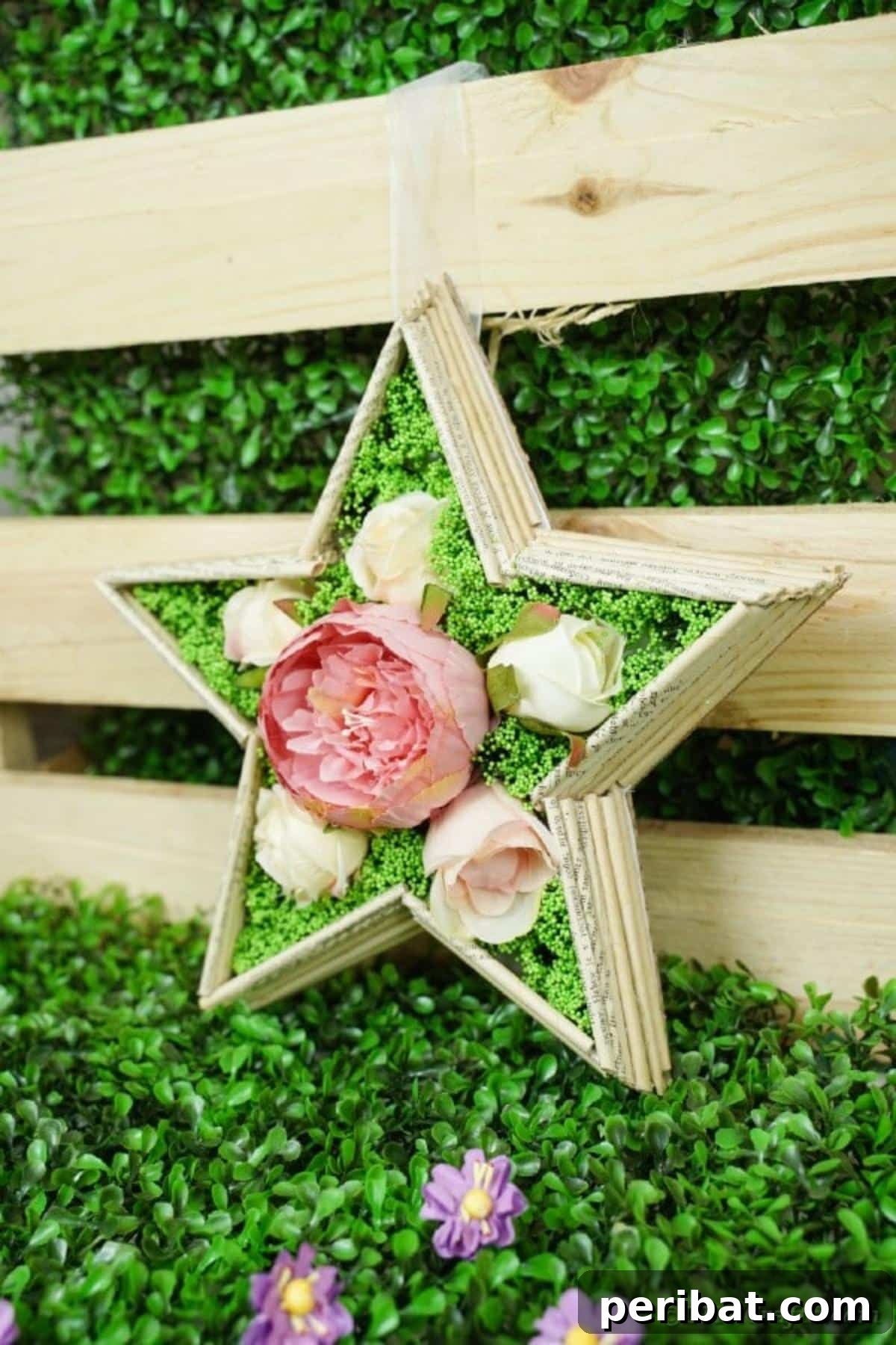 Literary Starburst Wall Decor 18 The completed old book page star wall art decoration, leaning against a rustic wooden crate, showcasing its final appearance.