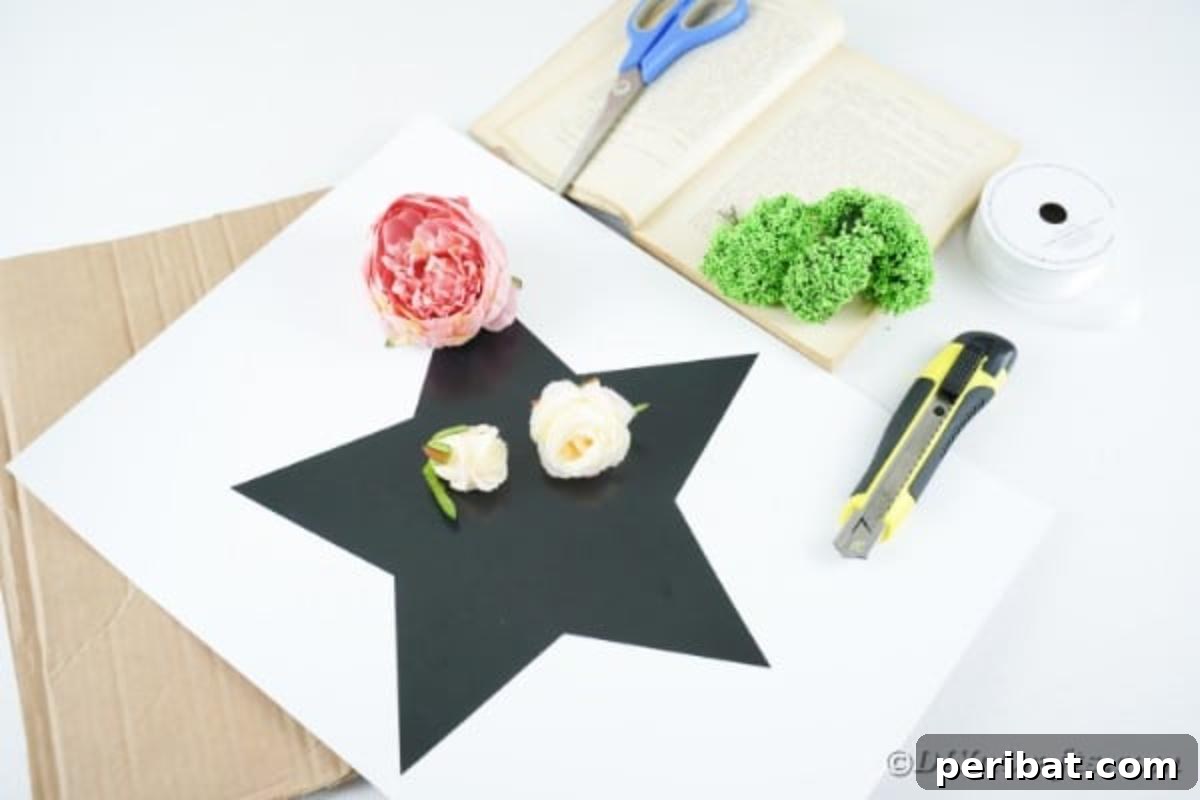 Literary Starburst Wall Decor 7 A flat lay arrangement of craft supplies, including book pages, scissors, glue, a star template, and artificial flowers, for making wall art.