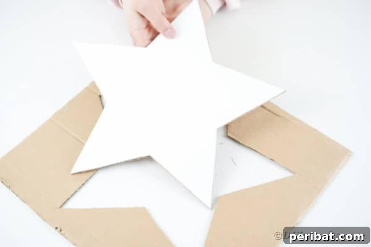 Literary Starburst Wall Decor 9 A craft knife is used to cut around the star template on cardboard, forming the sturdy base.