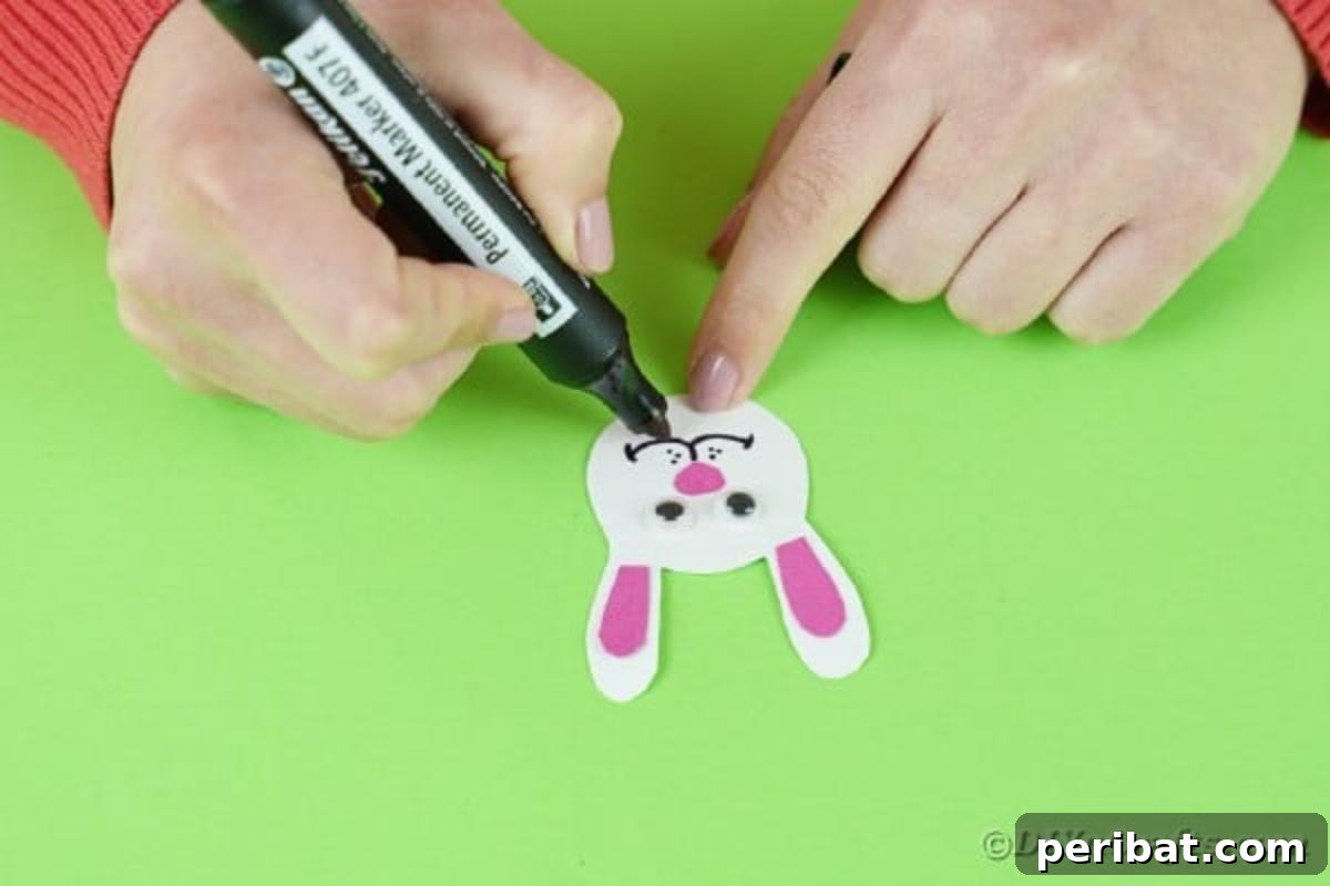 Popsicle Stick Easter Critter Bookmarks 11 Adding a smile to bunny face