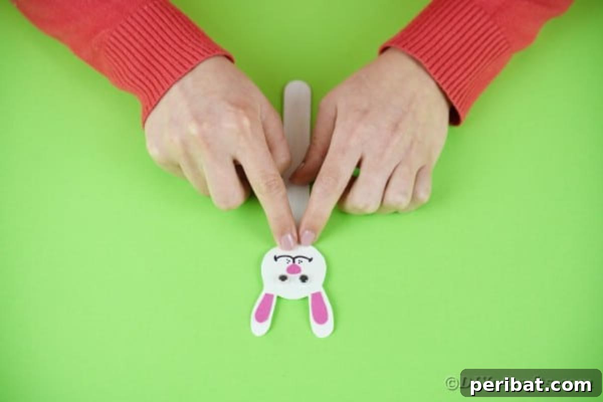 Popsicle Stick Easter Critter Bookmarks 12 Gluing bunny head to craft stick