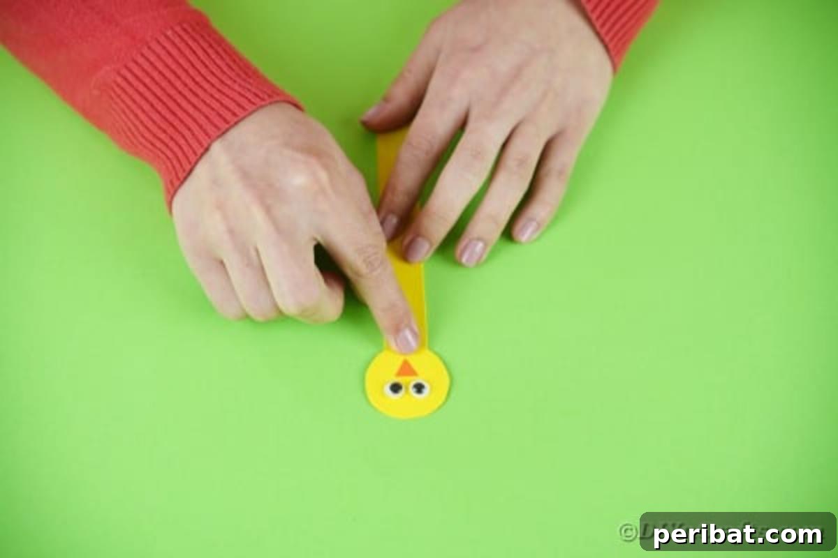Popsicle Stick Easter Critter Bookmarks 16 Gluing chicken head to craft stick