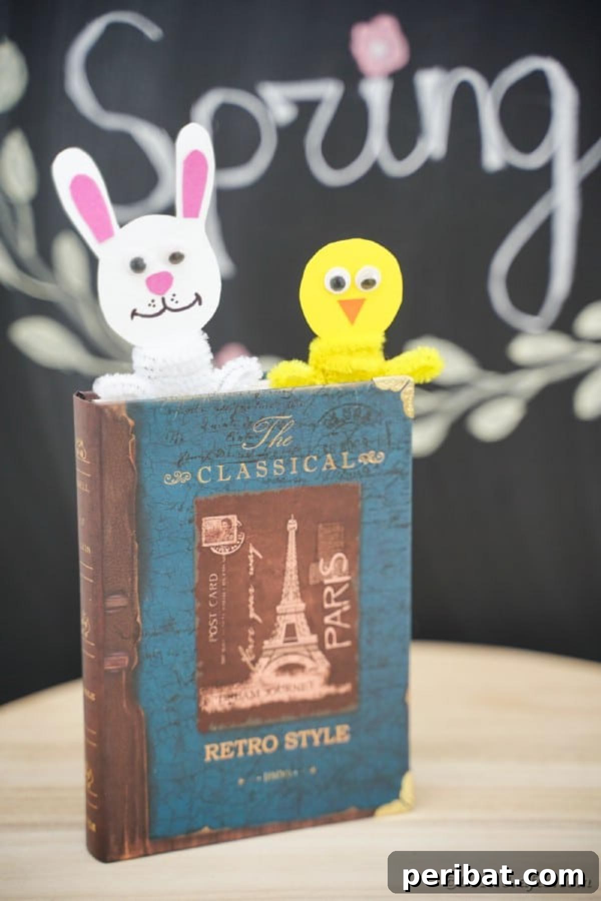 Popsicle Stick Easter Critter Bookmarks 4 Easter bookmarks in book in front of chalkboard
