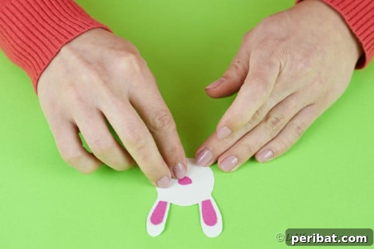 Popsicle Stick Easter Critter Bookmarks 9 Gluing ears onto bunny head