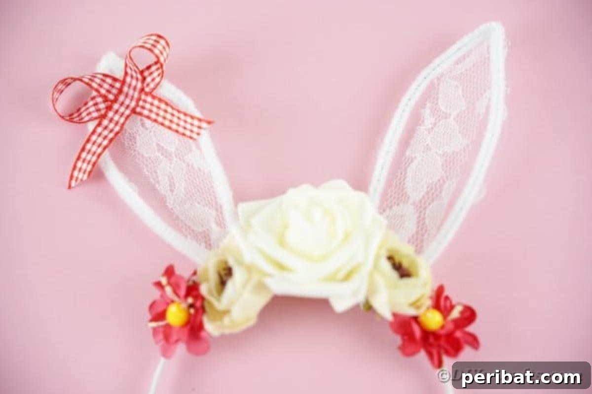 Delightful bunny ears headband resting on a soft pink surface