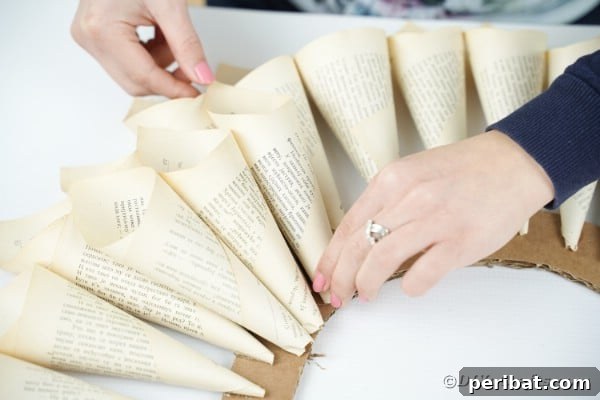 Aged Book Wreath Craft: Complete Video How-To 16 Layering paper cones on wreath
