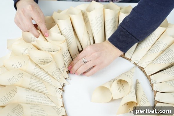 Aged Book Wreath Craft: Complete Video How-To 18 Adding smaller paper cones to ends of wreath