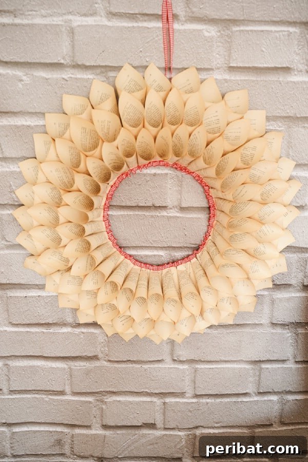 Aged Book Wreath Craft: Complete Video How-To 5 Wreath on brick wall