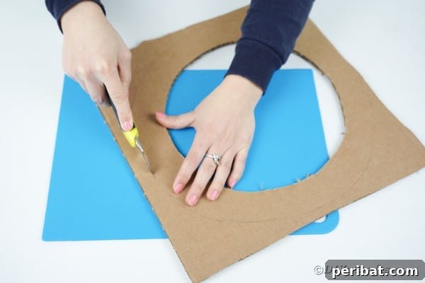 Aged Book Wreath Craft: Complete Video How-To 9 Cutting out a cardboard wreath
