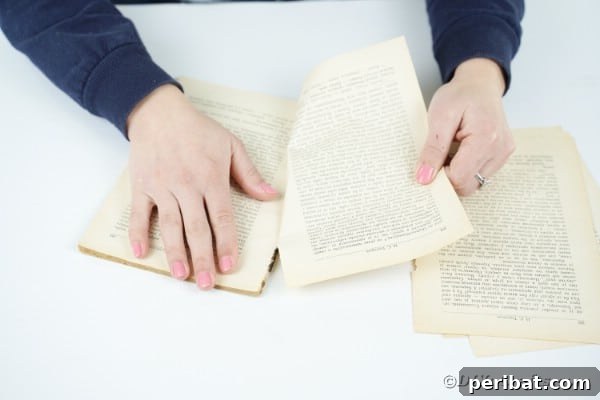 Aged Book Wreath Craft: Complete Video How-To 10 Tearing out book pages