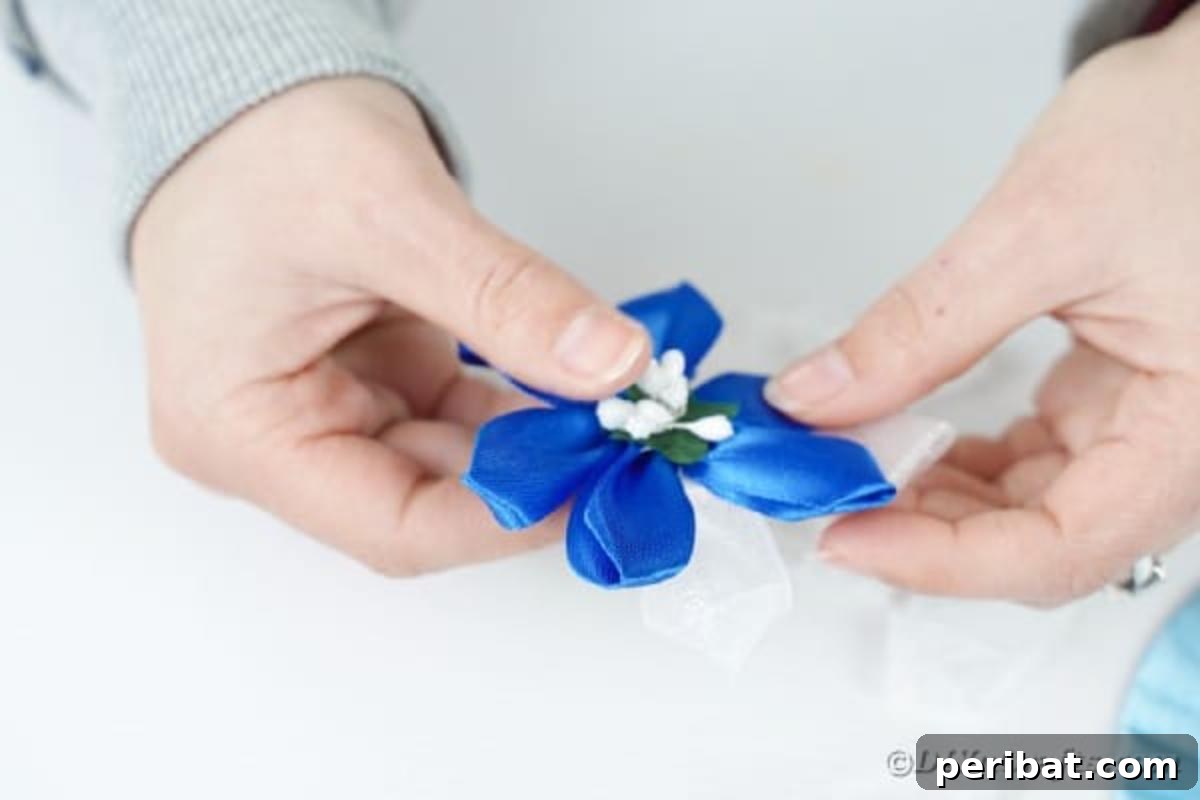 Shimmering Disc Curtain Tie-Backs 15 Gluing a flower into ribbon flower