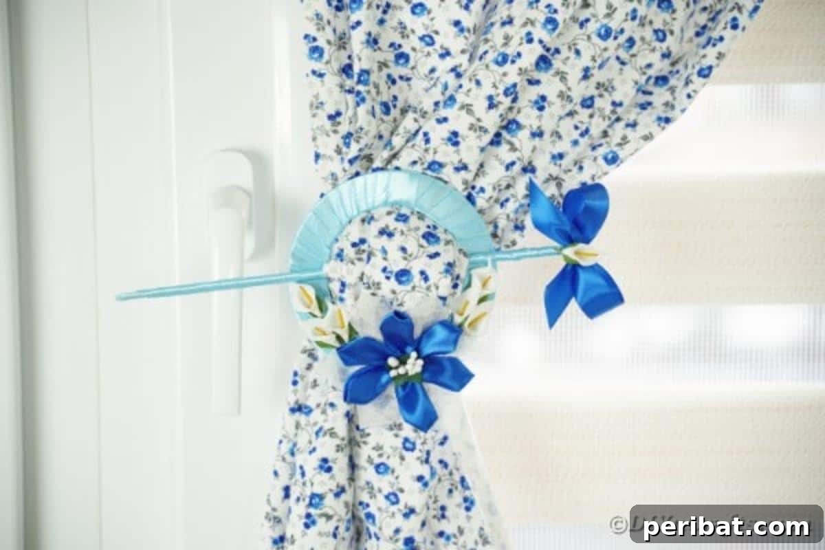 Shimmering Disc Curtain Tie-Backs 5 Blue cd curtain holder on blue foral cloth