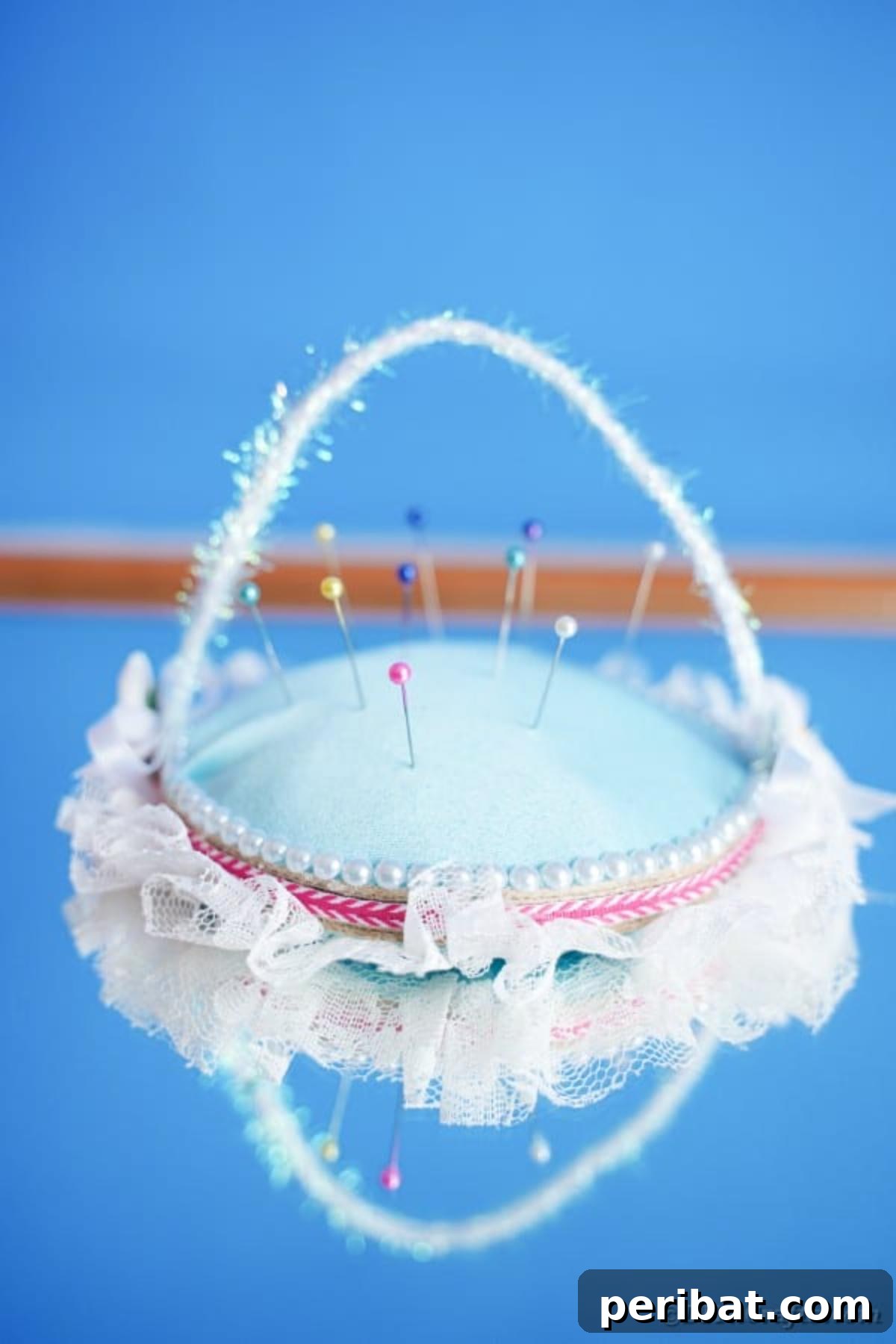 DIY CD Pincushion Basket: Upcycle Tutorial 3 Upcycled CD Pincushion on blue surface