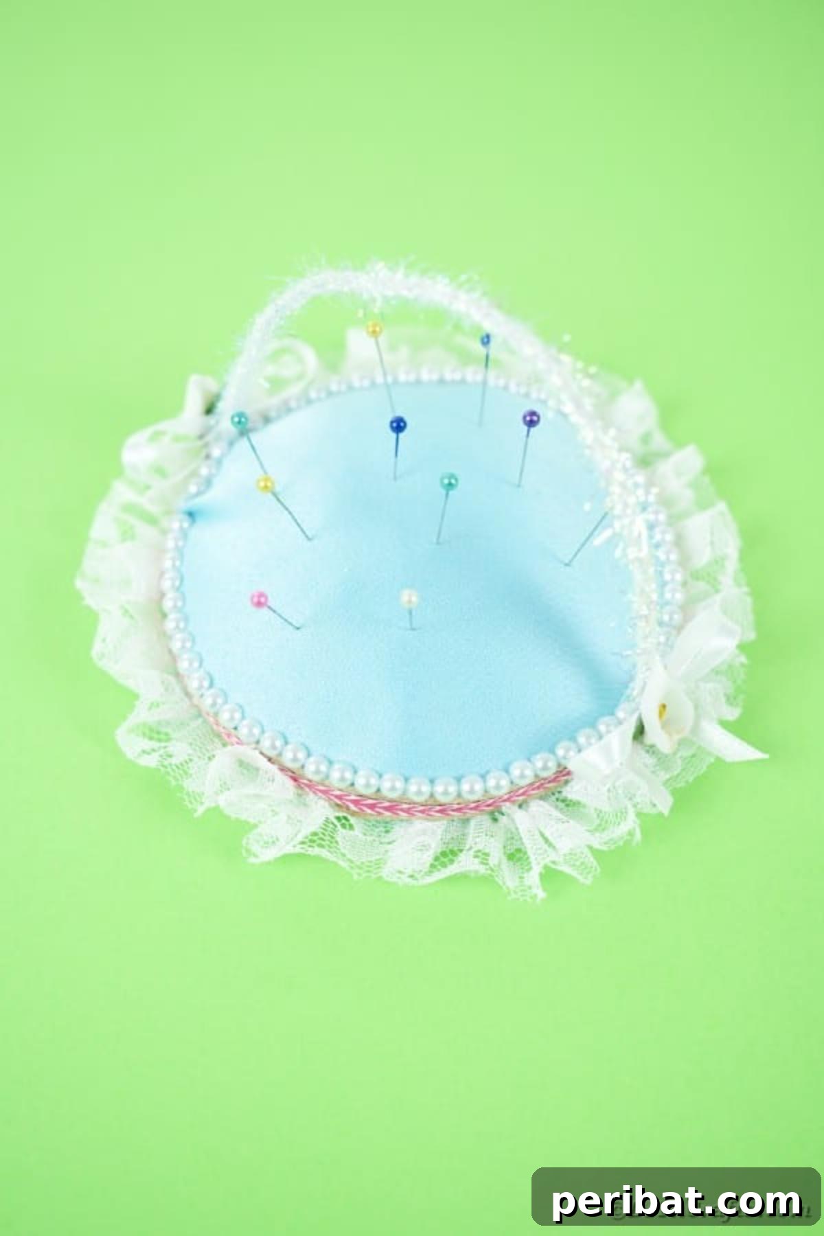 DIY CD Pincushion Basket: Upcycle Tutorial 5 Upcycled CD pincushion on green surface