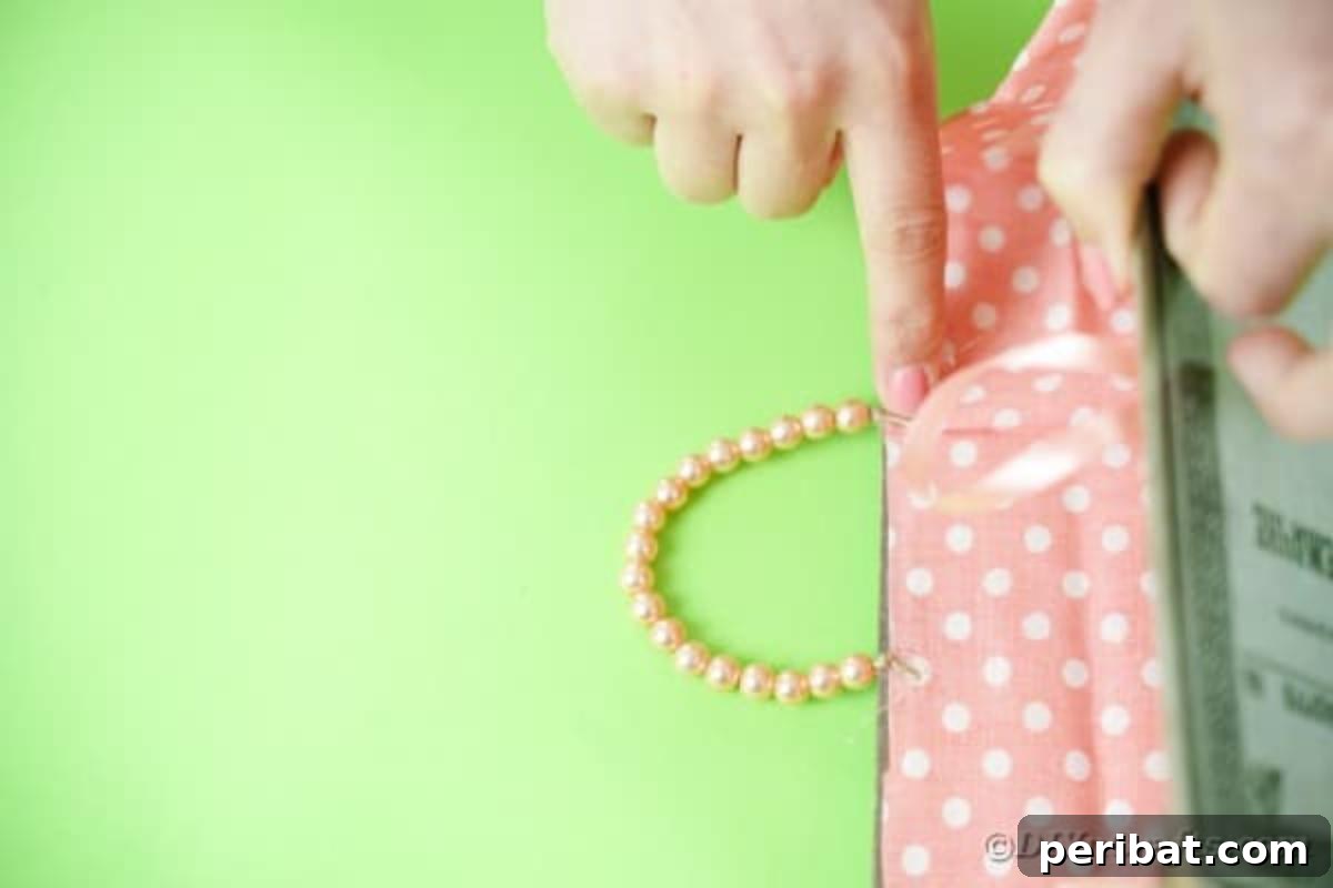 Old Books New Fashion DIY Book Purse Tutorial 17 Finishing touch: securely gluing the beaded handle to the inside of the book purse, ensuring it's robust and perfectly positioned for carrying