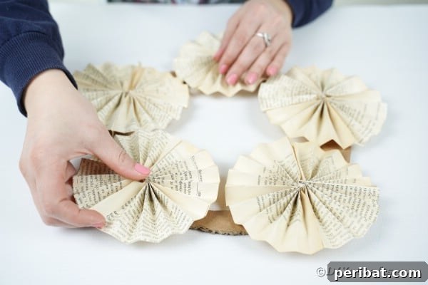 Enchanting Vintage Book Page Wreath Craft 28 Gluing fan papers on cardboard