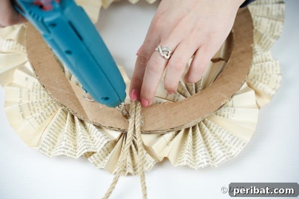 Enchanting Vintage Book Page Wreath Craft 30 Adding twine to wreath