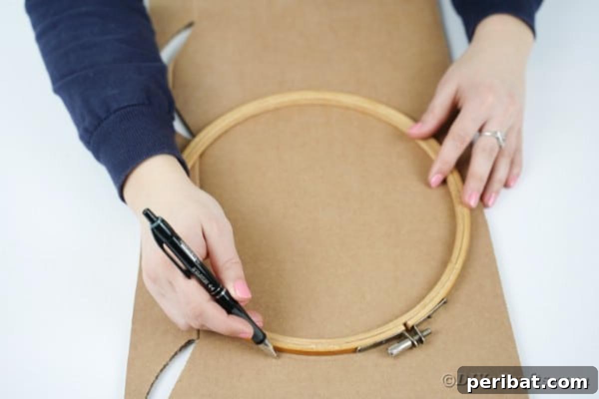 Enchanting Vintage Book Page Wreath Craft 7 Measuring and tracing a wreath shape onto a piece of cardboard using a circular object.