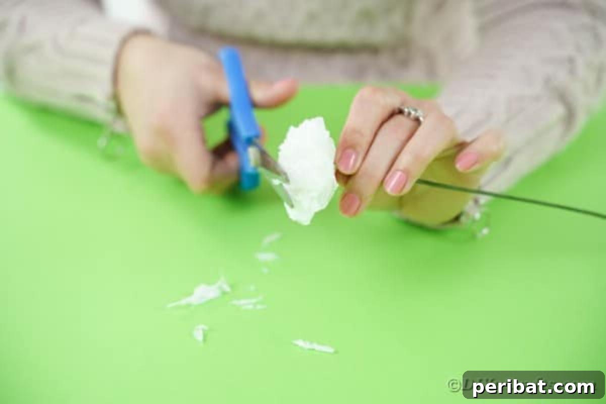 Craft Vibrant Tissue Blooms Video Tutorial 11 Scissors trimming the edges of a tissue paper flower to create a more natural, rounded petal shape