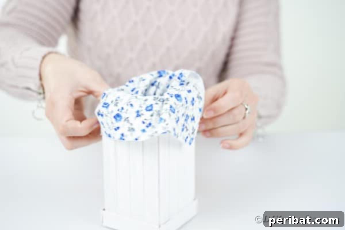 Craft Your Own Milk Carton Organizer Tutorial 13 Gluing fabric inside a craft stick box