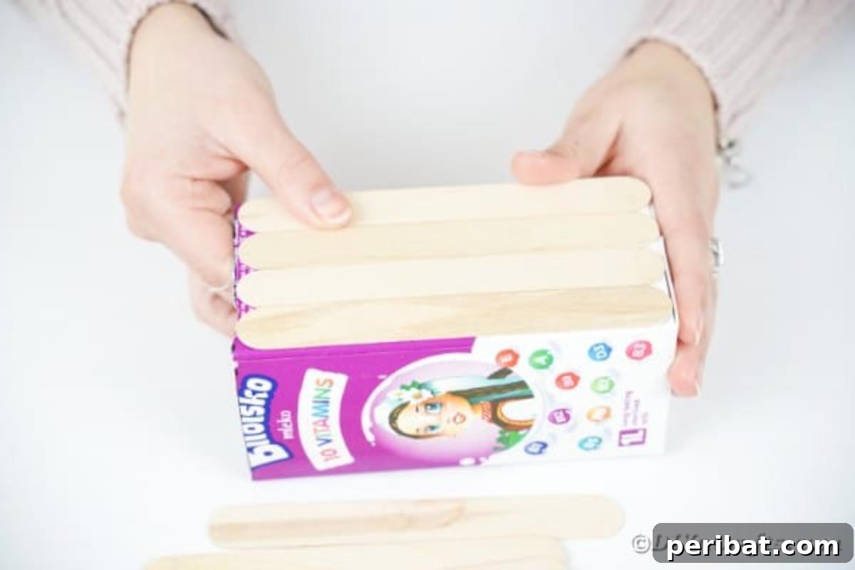 Craft Your Own Milk Carton Organizer Tutorial 10 Gluing crafts onto milk carton